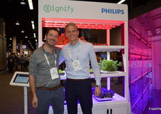 In front of the Dutch national colors: Roel Janssen (Signify) and Thomas Wennekers (Codema Systems Group).